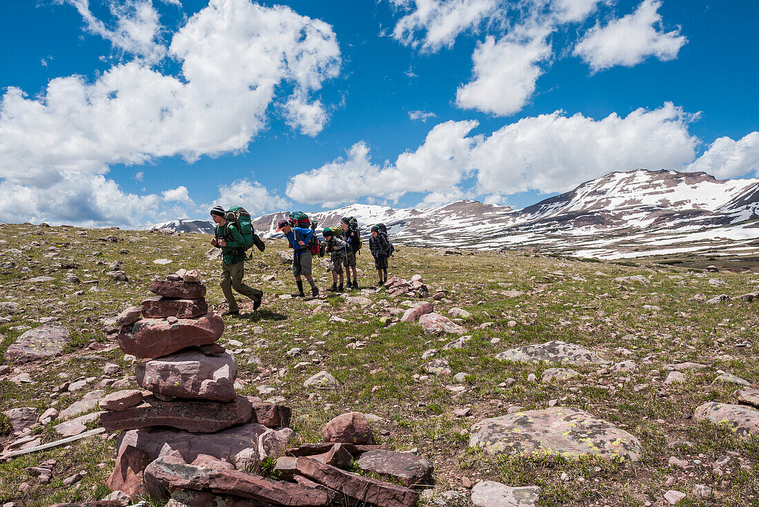 Boys from Scout Troop 693 hike across Tungsten Pass 11, 500 feet surrounded by snowy peaks, on the fourth day of a six day trip through the High Uintas Wilderness Area, Uintas Range, Utah