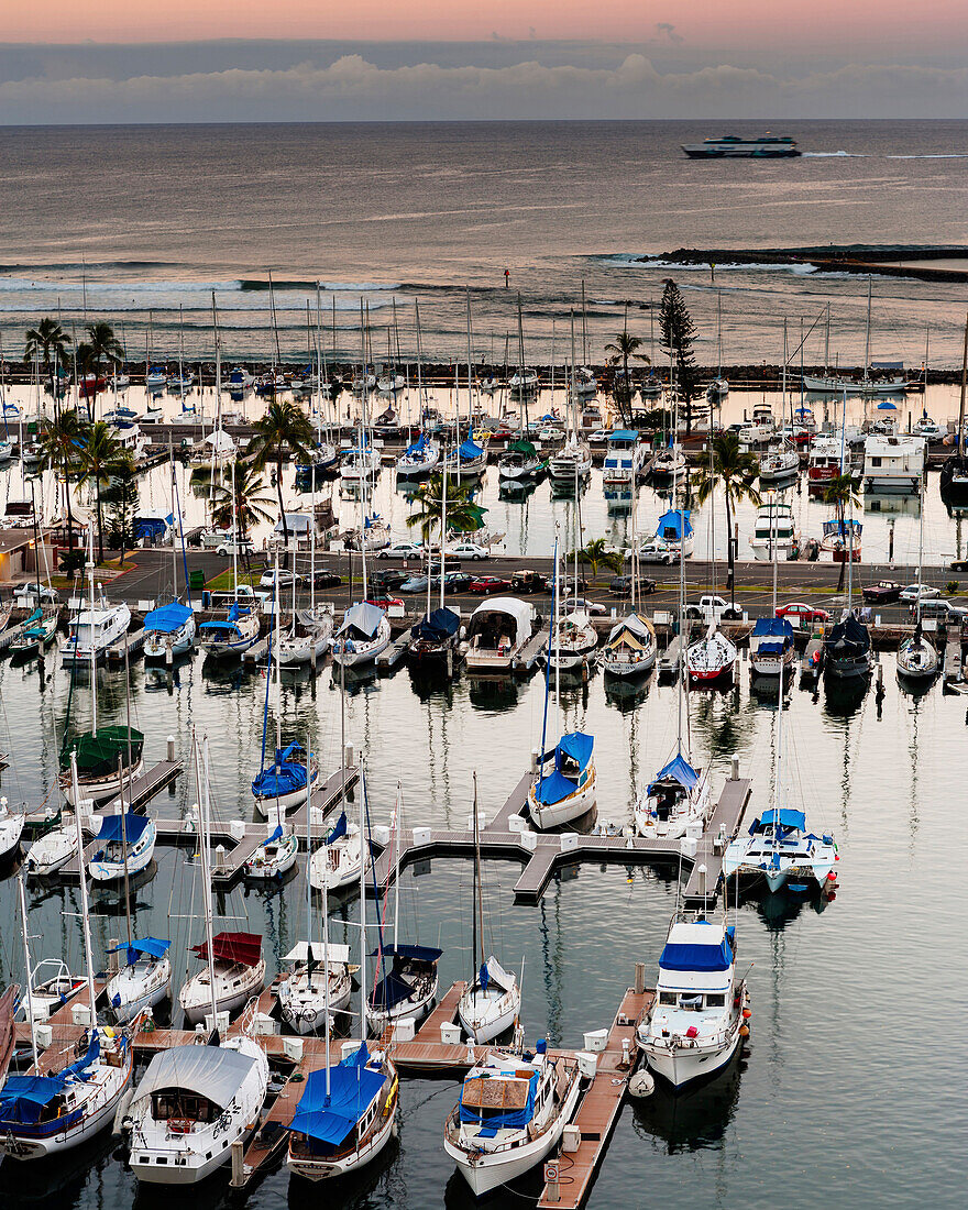 Elevated view of a sailboats in a yacht harbor in a Hawaii, USA.