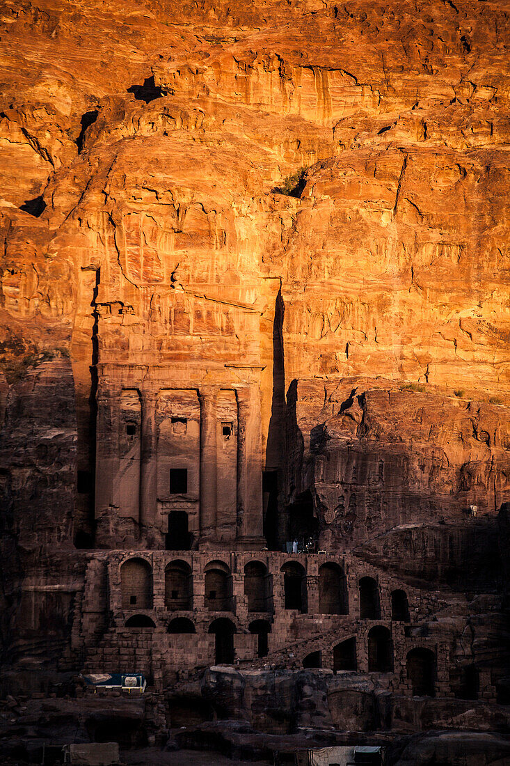 Carved stone facades at Petra, Jordan at sunset.