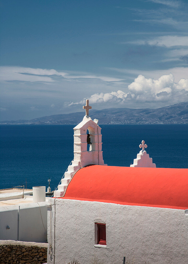 Traditional bell arch and seascape under blue sky