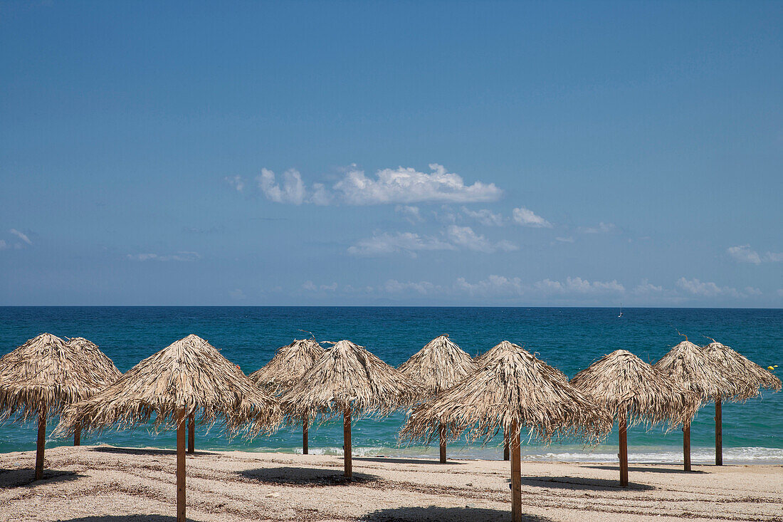 Thatch umbrellas on beach