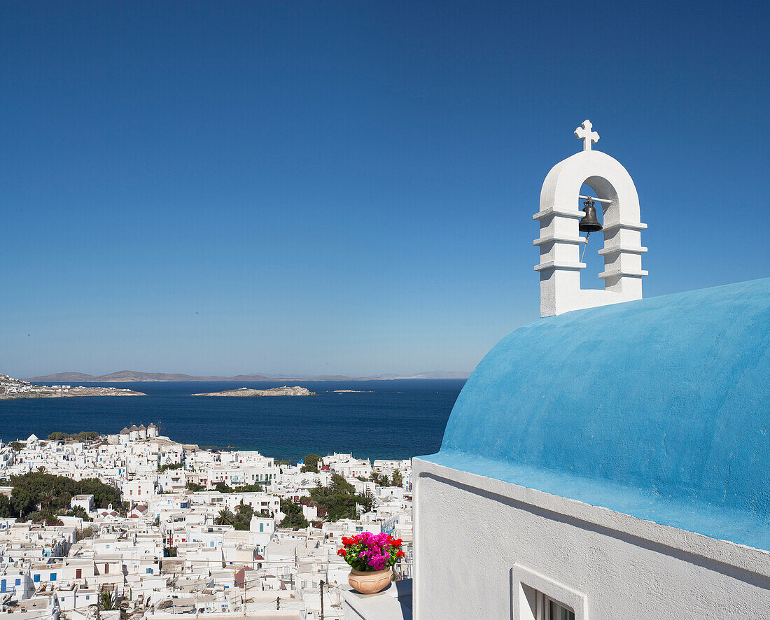 Traditional church and Mykonos cityscape, Cyclades, Greece