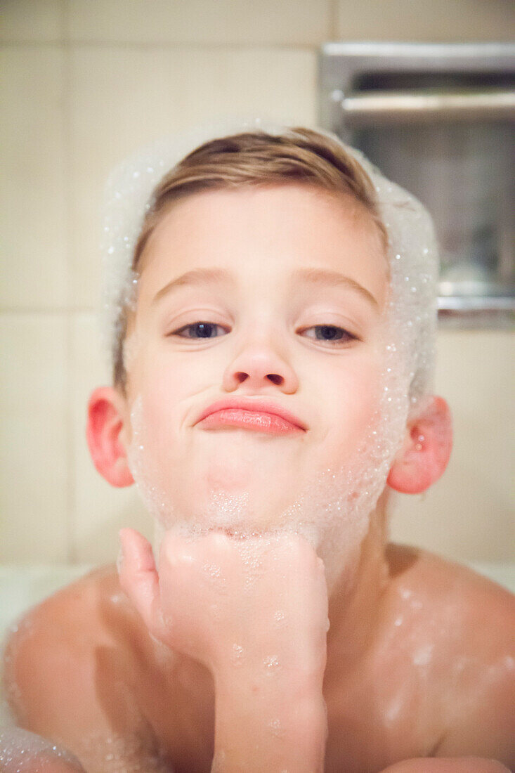 Boy with Soap Suds on his Head in Bathtub