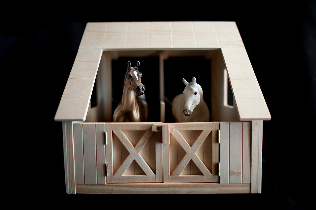 Two Miniature Toy Horses in Stable