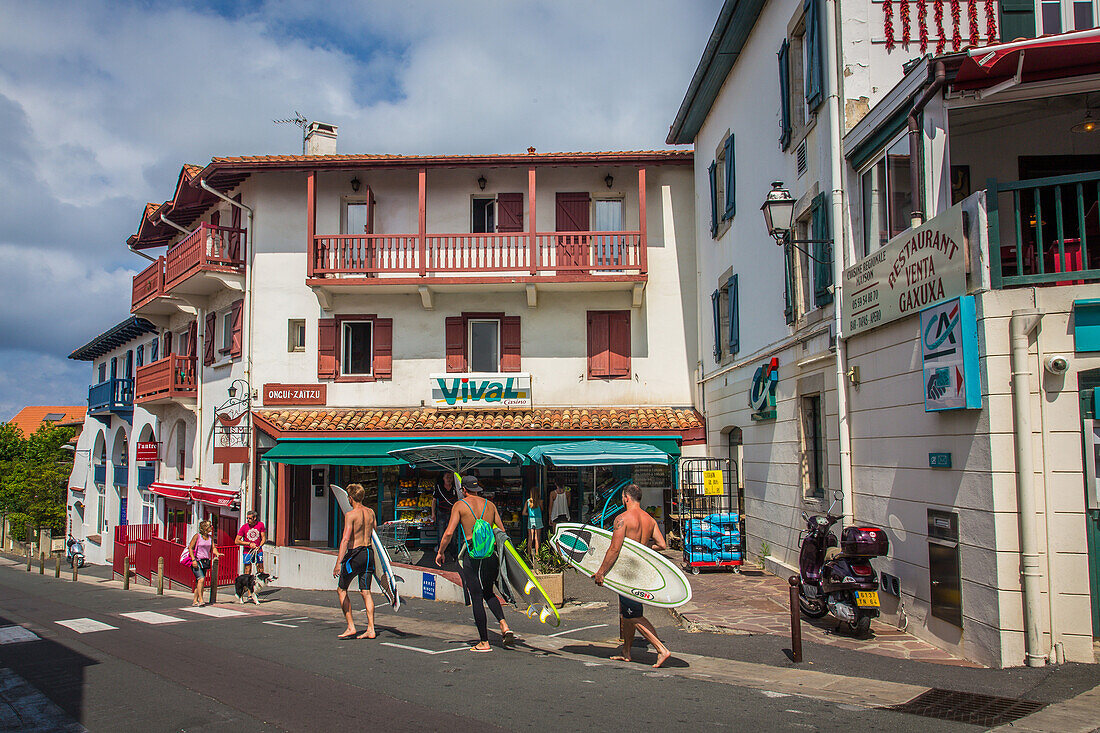 surfers in the street, bidart, (64) pyrenees-atlantiques, aquitaine