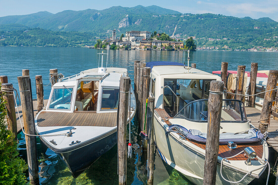 Boats moored in a harbour on Lake Orta Orta, Piedmont, Italy