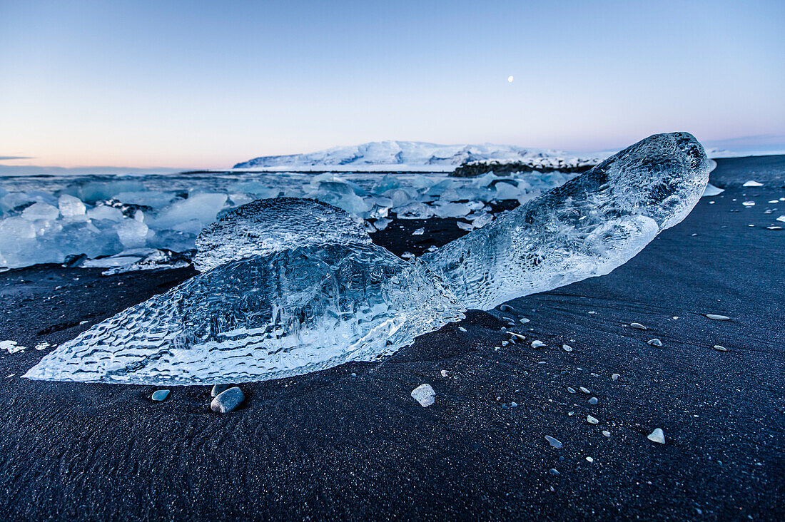 Joekulsarlon, Growler on the beach at sunrise, Glacierlagoon, Vatnajoekull Glacier, Winter, Iceland