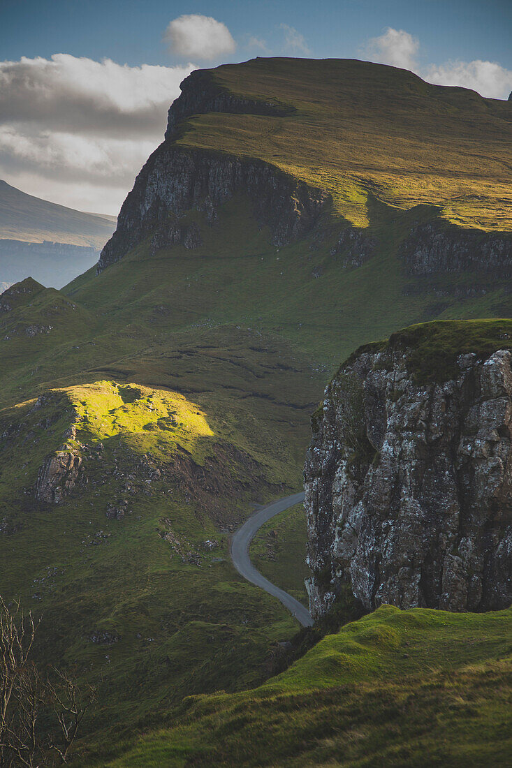 Low angle view of green mountains against sky