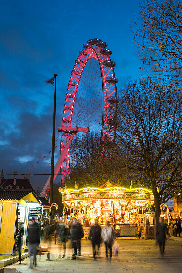 Christmas Market in Jubilee Gardens, with The London Eye at night, South Bank, London, England, United Kingdom, Europe