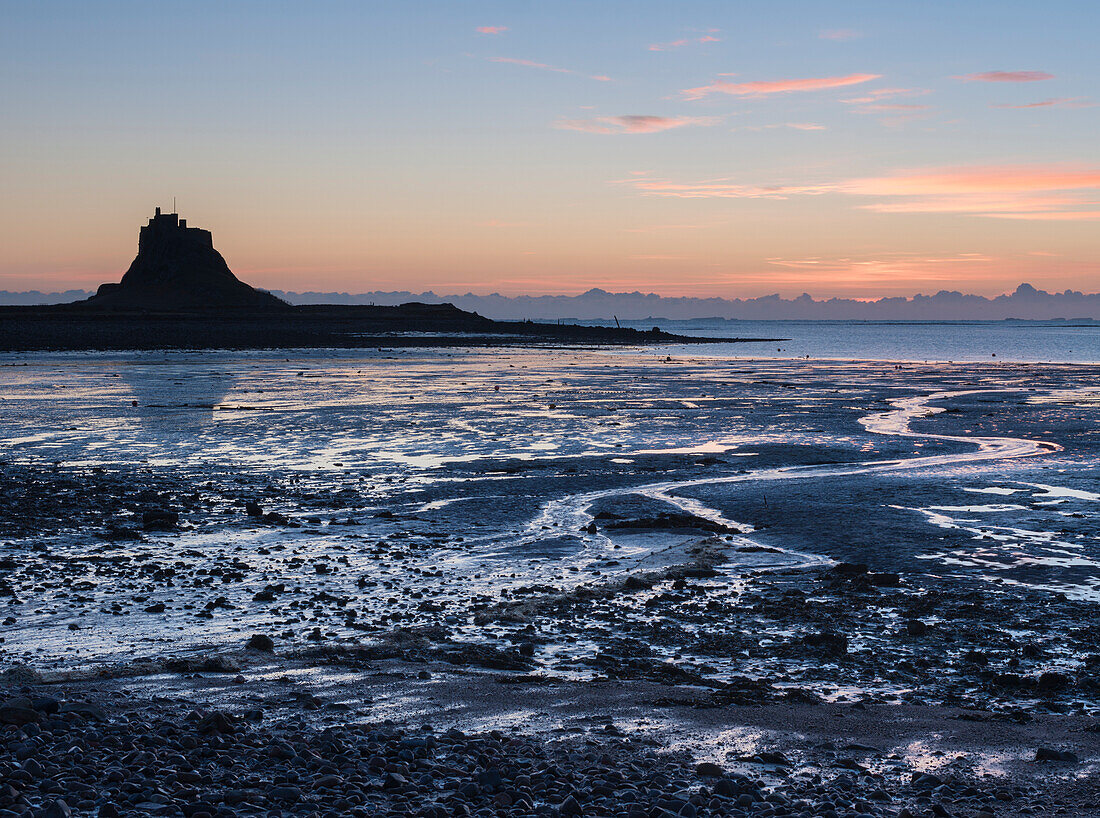 A view across the Ouse to Lindisfarne Castle, Holy Island, Northumberland, England, United Kingdom, Europe