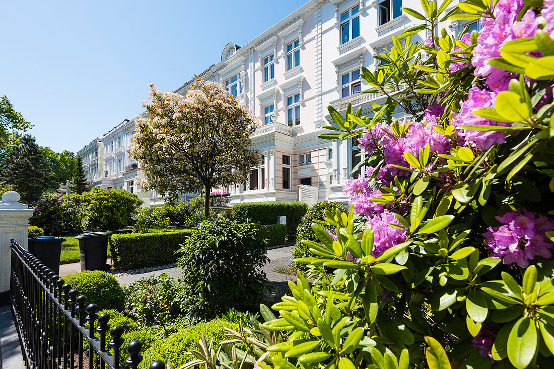 Houses and town villas in the nice streets of the famous and preferential districts of Harvestehude and Rotherbaum near the lake Außenalster during the rhododendron blossom, Hamburg, Germany