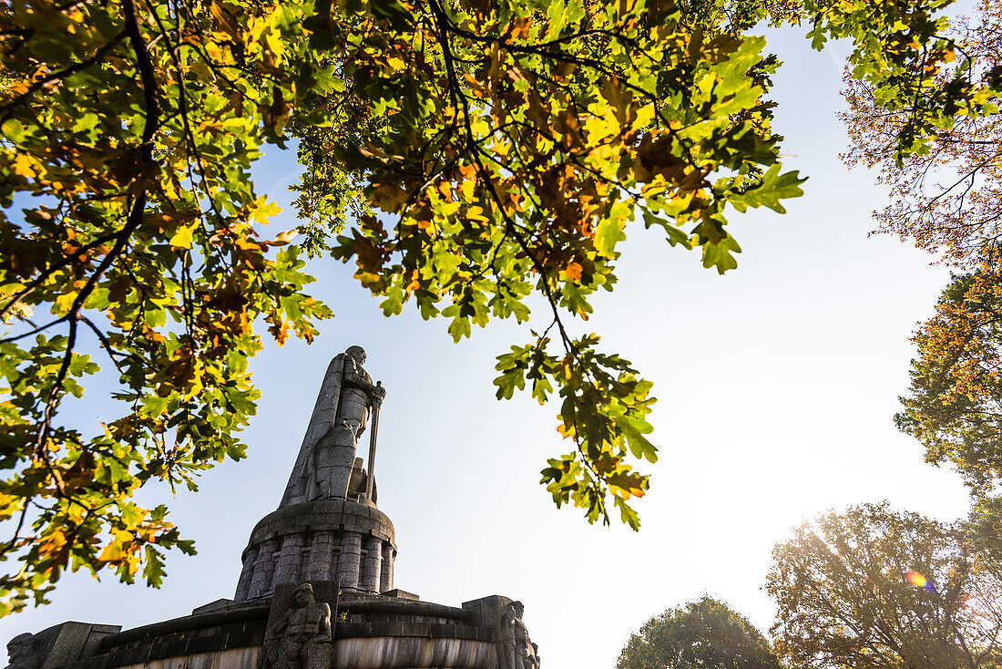 The granite statue, the highest Bismarck monument (34,3m) of the world in the old Elbpark above the Landungsbrücken in autumn, Hamburg, Germany
