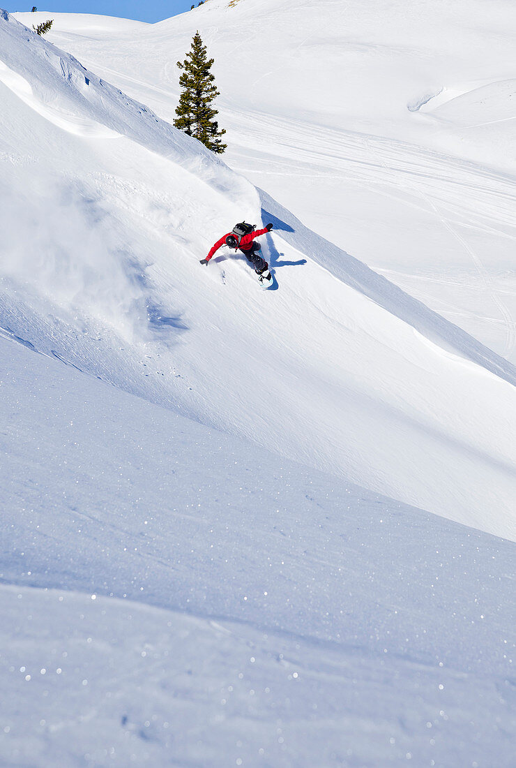 A man rides his snowboard in the backcountry on Togwotee Pass in Wyoming.