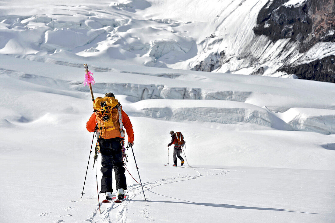 The team carries a cache past the ice fall to 11,000-feet on a ski ascent of  Mount Sanford Sheep Glacier Route in the Wrangell-St. Elias National Park outside of Glennallen, Alaska June 2011.  Mount Sanford at 16,237 feet is the sixth tallest mountain in