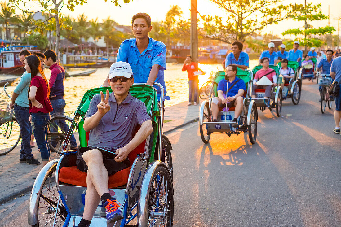 Tourists on a Cyclo tour of Hoi An Ancient Town, Hoi an, Quang Nam Province, Vietnam