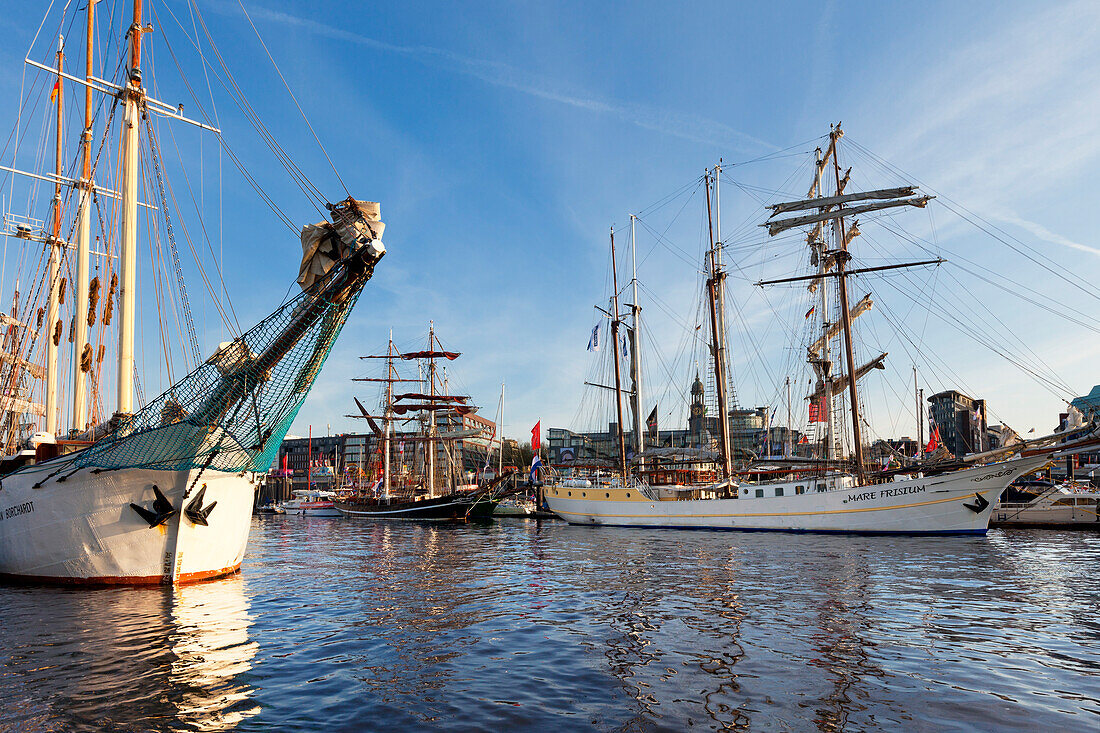 Sailing ships in the harbour in front of the Michel, St Michaelis church, Hamburg, Germany
