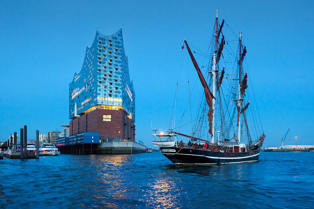 Sailing ship Eye of the Wind in front of the Elbphilharmonie, Hamburg, Germany