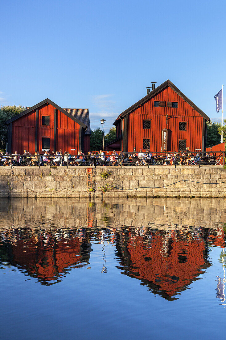 People sitting outside in the restaurant Rökeriet in the harbour of Nyköping, Södermanland, South Sweden, Sweden, Scandinavia, Northern Europe, Europe