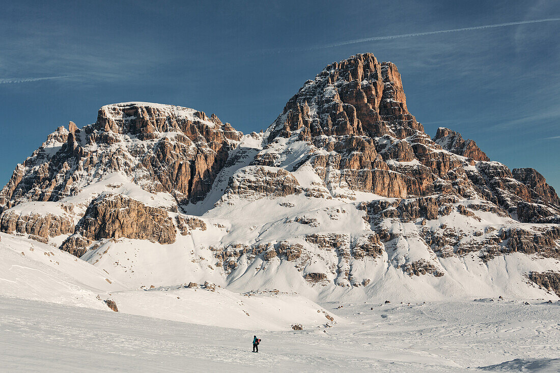 Snowshoe hiker beneath the Dreischusterspitze, Sexten  Dolomites, Unesco world heritage, Italy