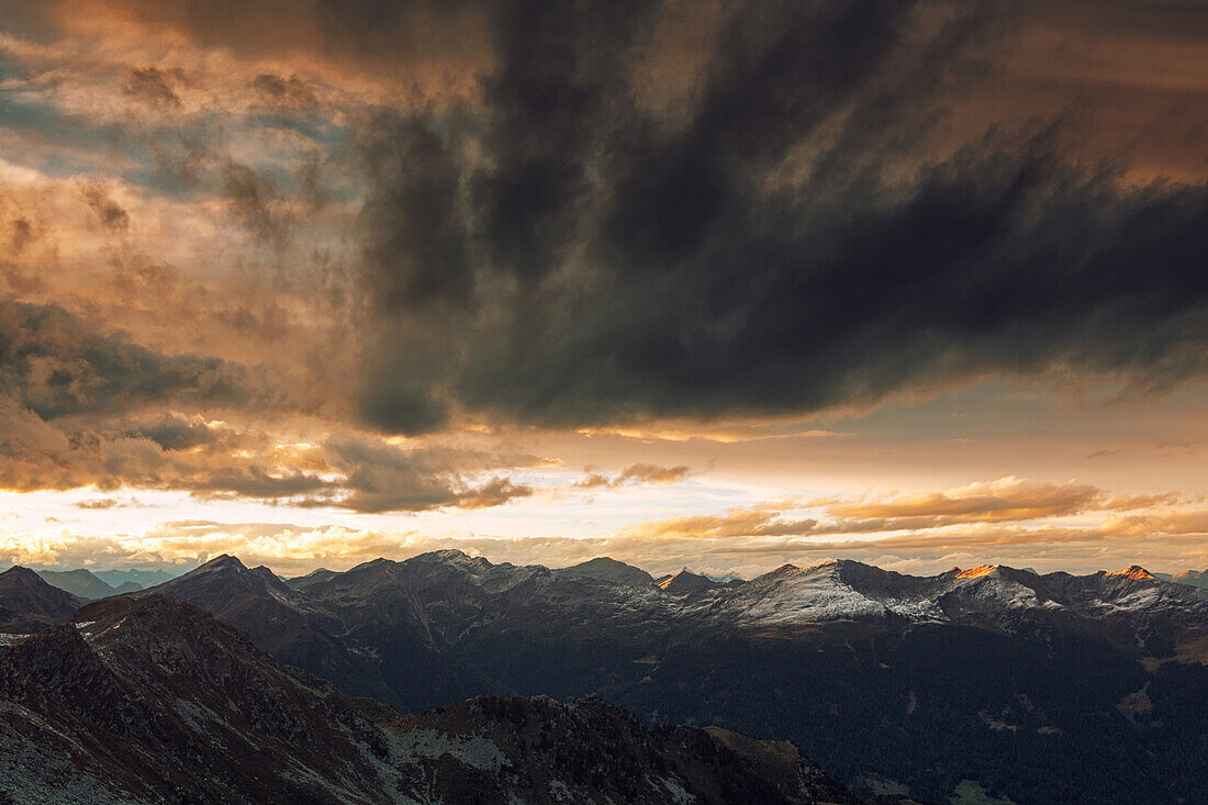 View from Koenigsangerspitze at sunset in the direction of Sarntal valley, South Tyrol, Italy