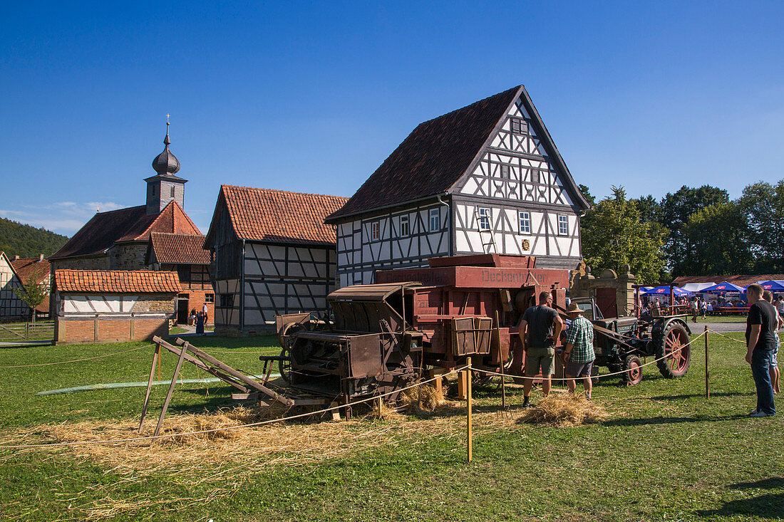 Harvesting display during Museumsfest celebration at Fränkisches Freiluftmuseum Fladungen open air museum