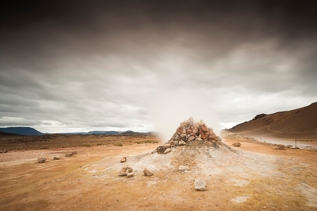A small steam geyser at Námafjall geothermal area, North Iceland.