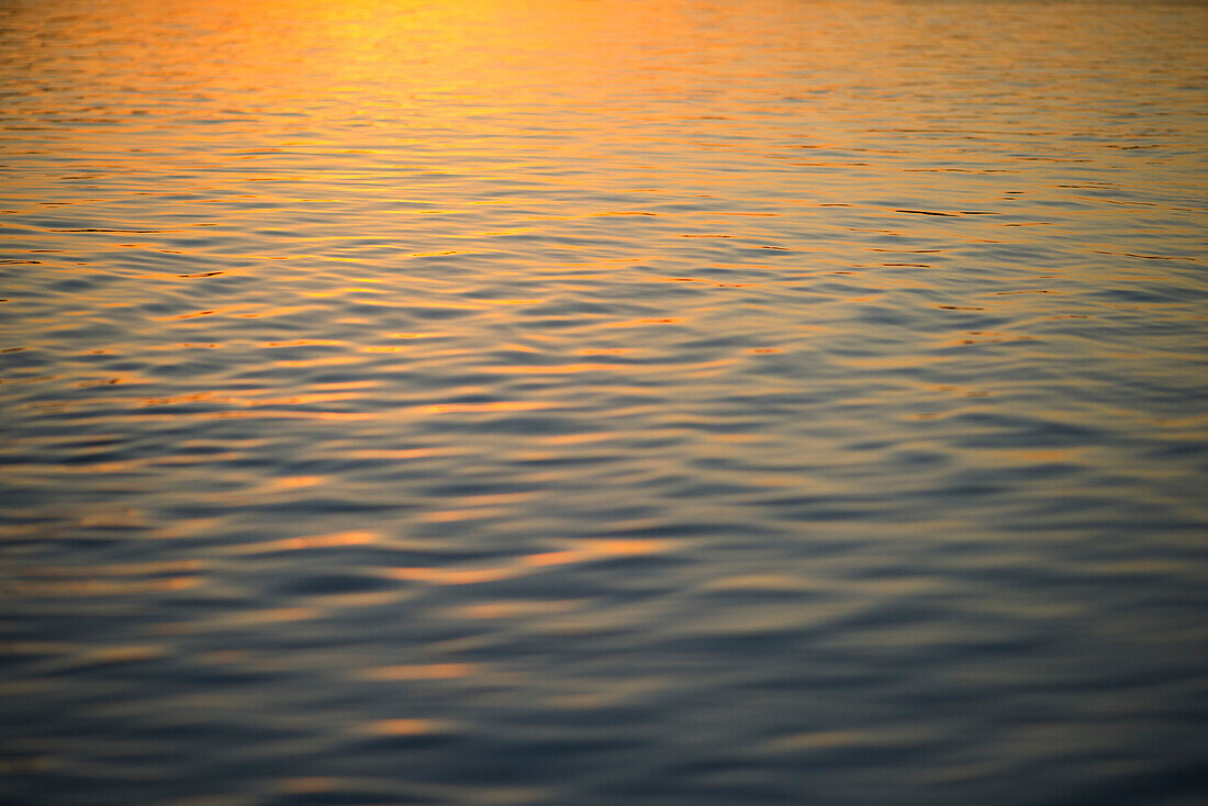 Sunset reflected on surface of water