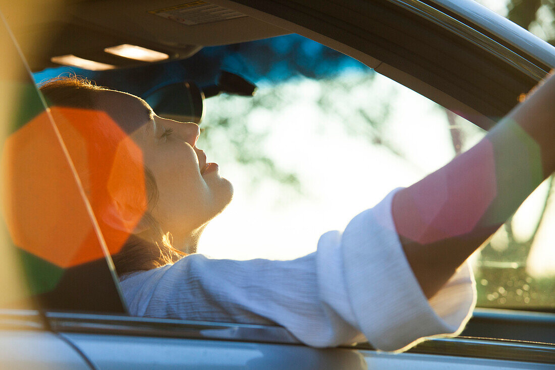 Woman passenger riding in car