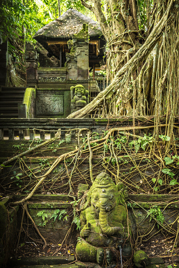 Balinese temple entrance with monkey statues in the temple town of Ubud, Bali, Indonesia