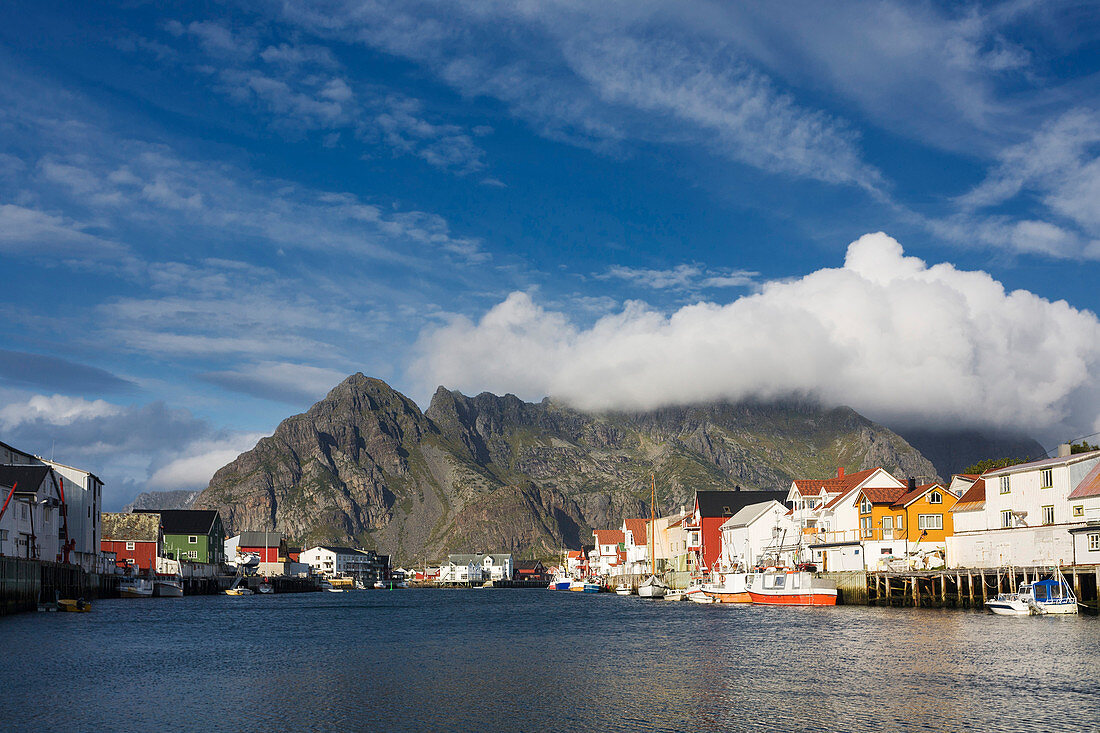 Overlooking the harbor of Henningsvaer with mountains in the background, Lofoten, Nordland, Norway, Scandinavia