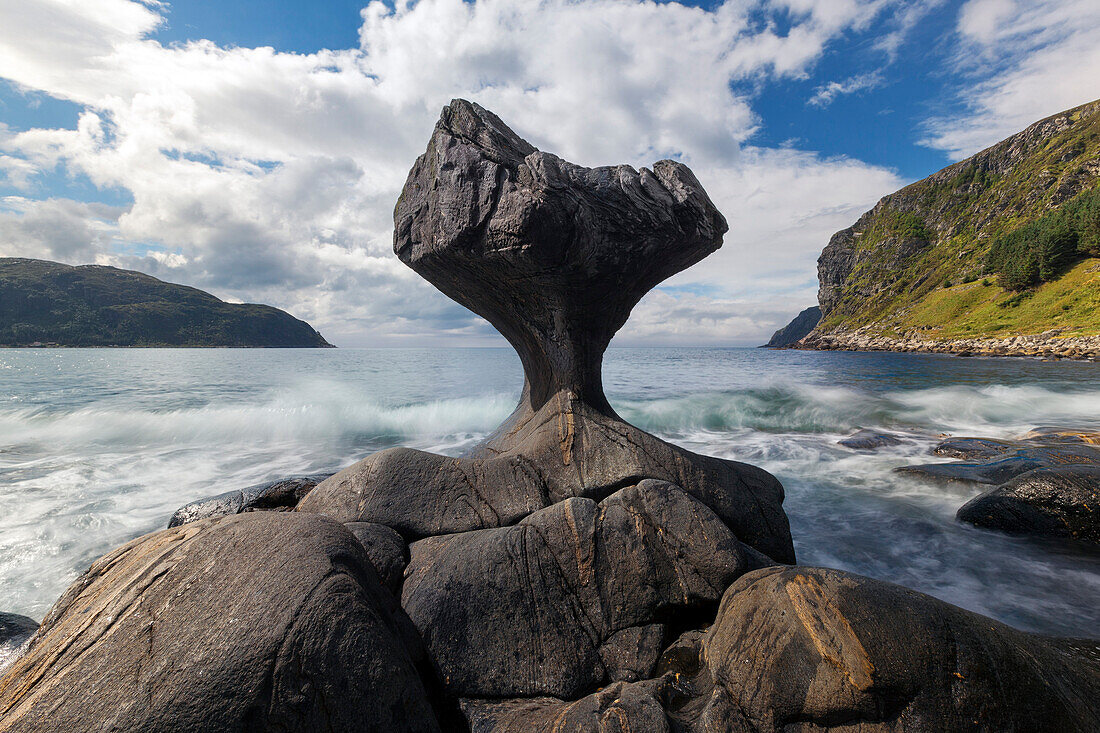 Distinctive eroded rocks stone Kannestein with surf and sun, Vågsøya, Fylke, Sogn og Fjordane, Norway, Scandinavia
