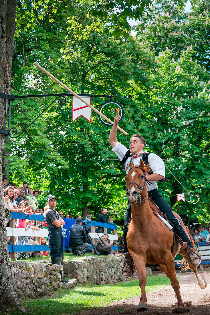 Castelrotto, South Tyrol, Italy. The traditional ring jousting at the Monte Calvario