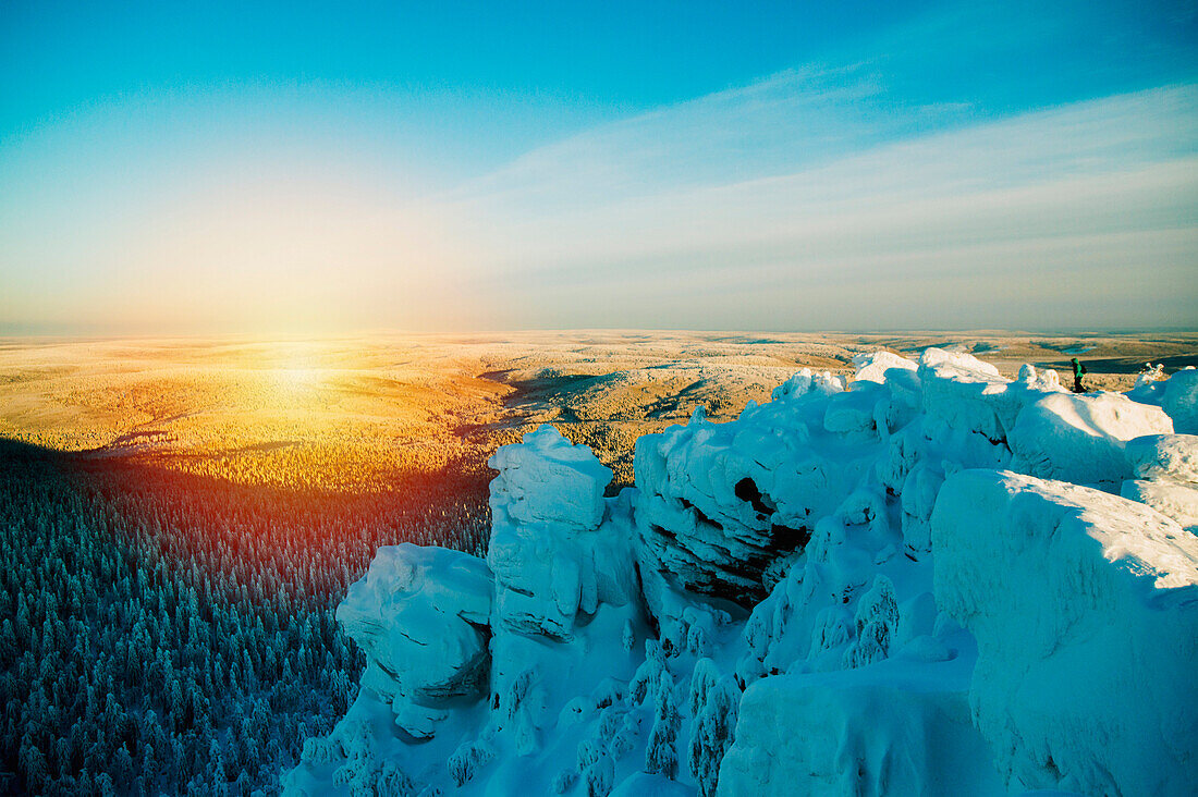 Snowy hilltop overlooking remote landscape