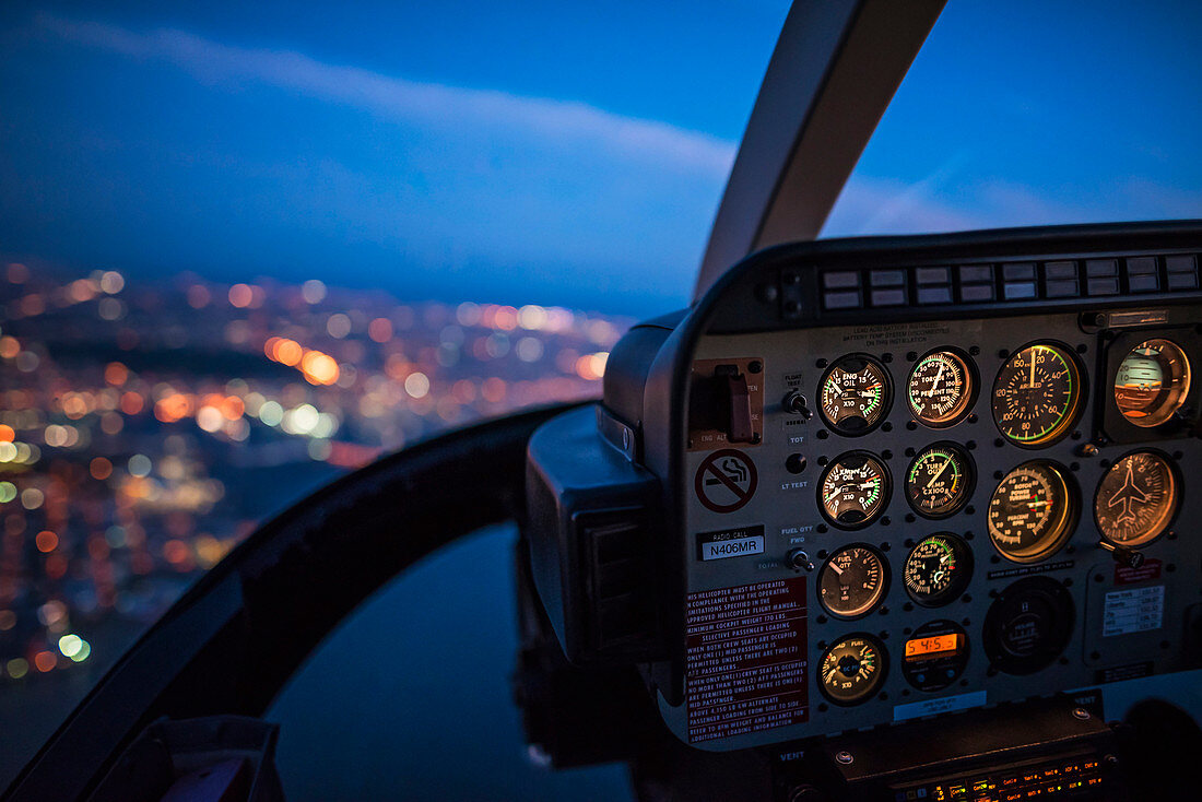 Close up of control panel of airplane flying at night