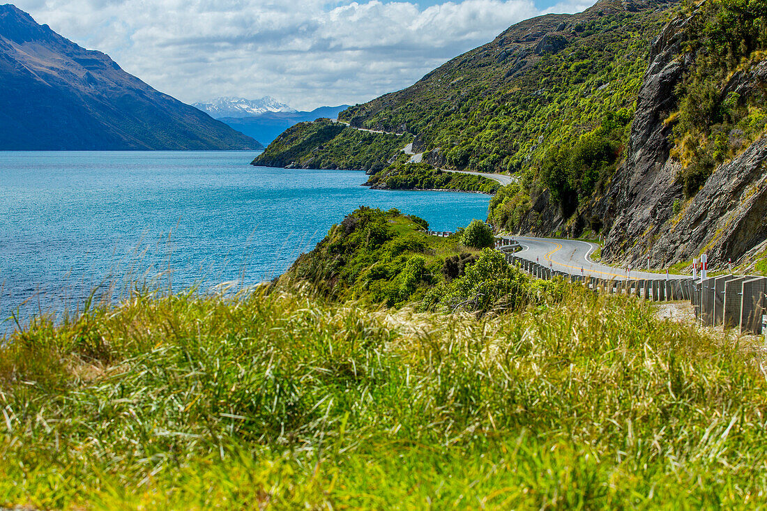 Highway on remote mountains near lake, Queenstown, Otago, New Zealand