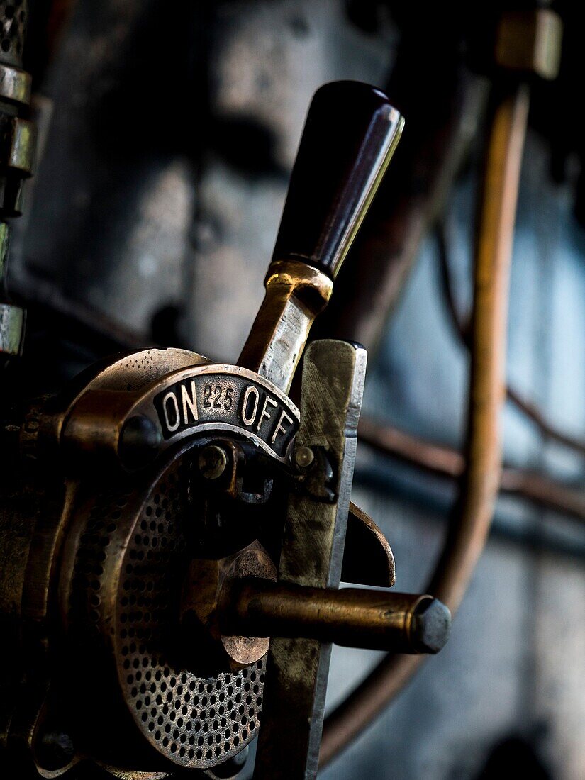 controls of a vintage steam locomotive at Loughborough station, on the Great Central Railway in Leicestershire,UK.