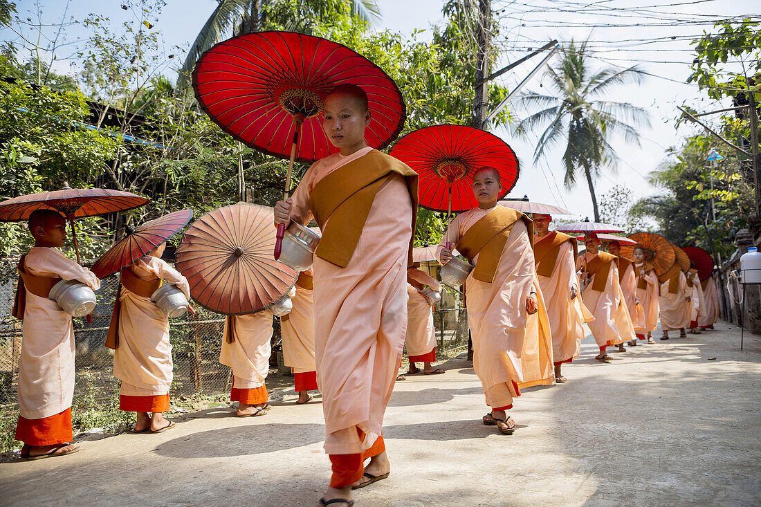 Myanmar ,near Yangon Kyauktan City, Nuns paradeing.