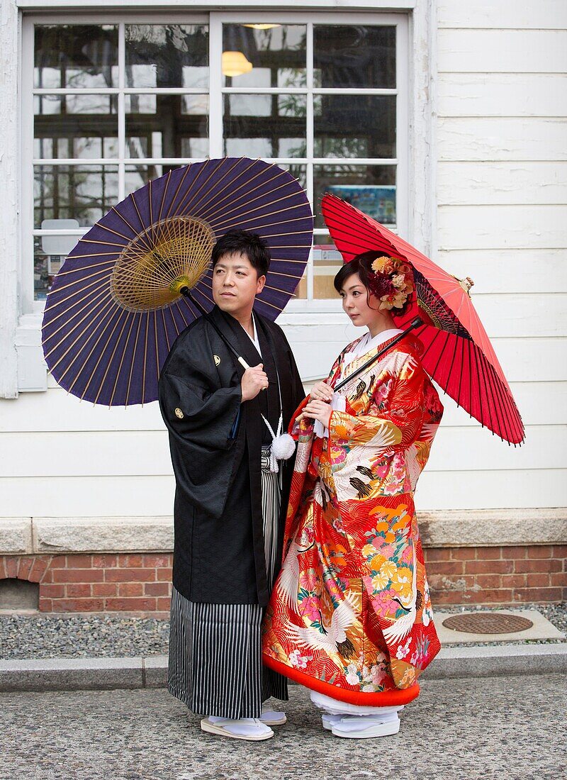 Japan,Okayama, Kurashiki City, Couple in traditional costume.