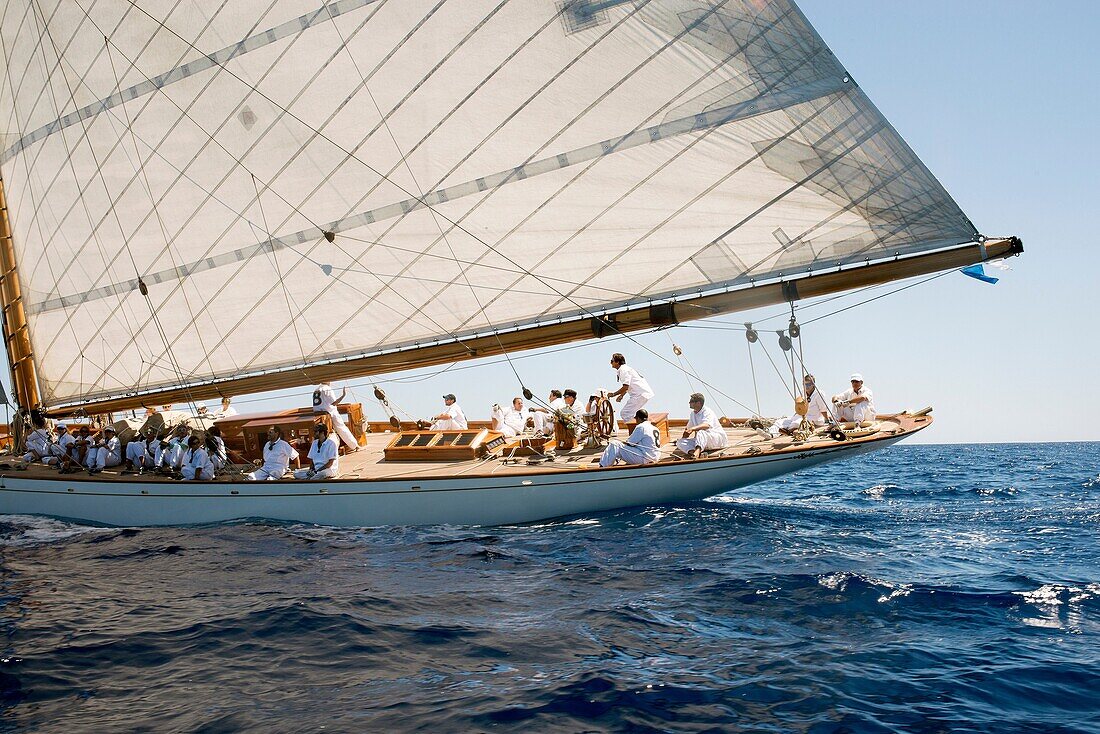 Vintage boat sailing in a race, at the Mediterranean Sea. Menorca. Baleares, Spain, Europe