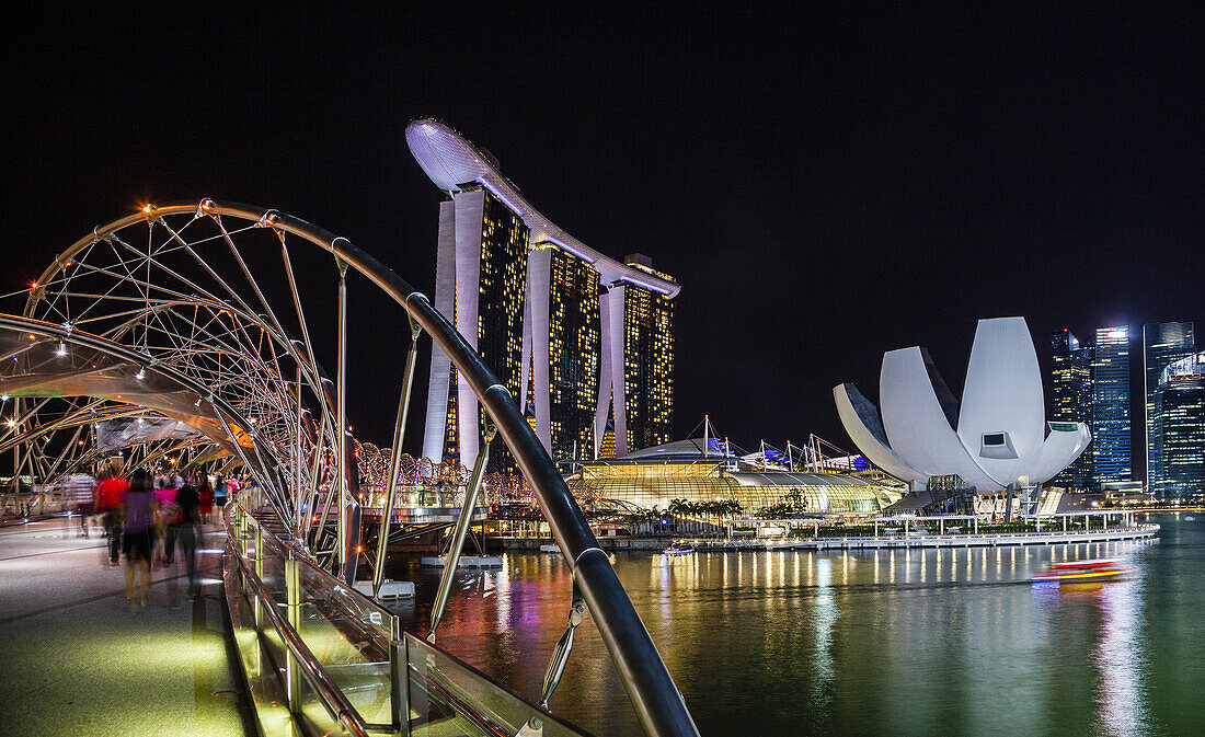 Singapore, night view of Marina Bay Sands, Art Science Museum and the Helix Bridge.