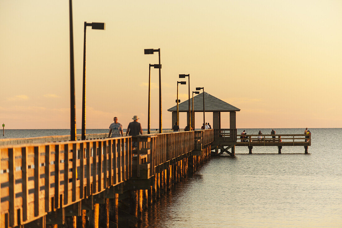 The fishing pier at sunset on the Gulf of Mexico in Biloxi, Mississippi.