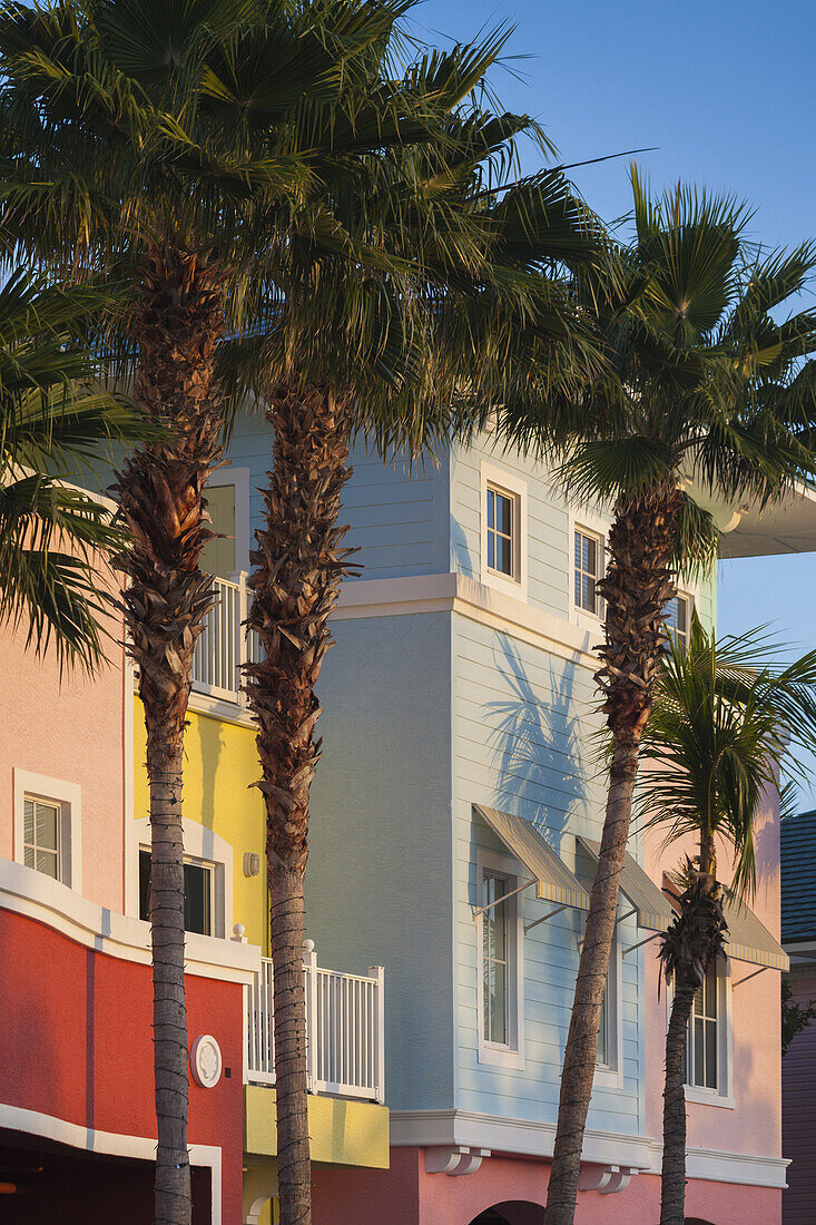 USA, Florida, Gulf Coast, Fort Myers Beach, pastel buildings and palm trees, dawn.