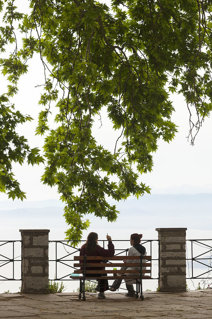 Greece, Thessaly Region, Makrinitsa, Pelion Peninsula, outdoor cafe tables with people.