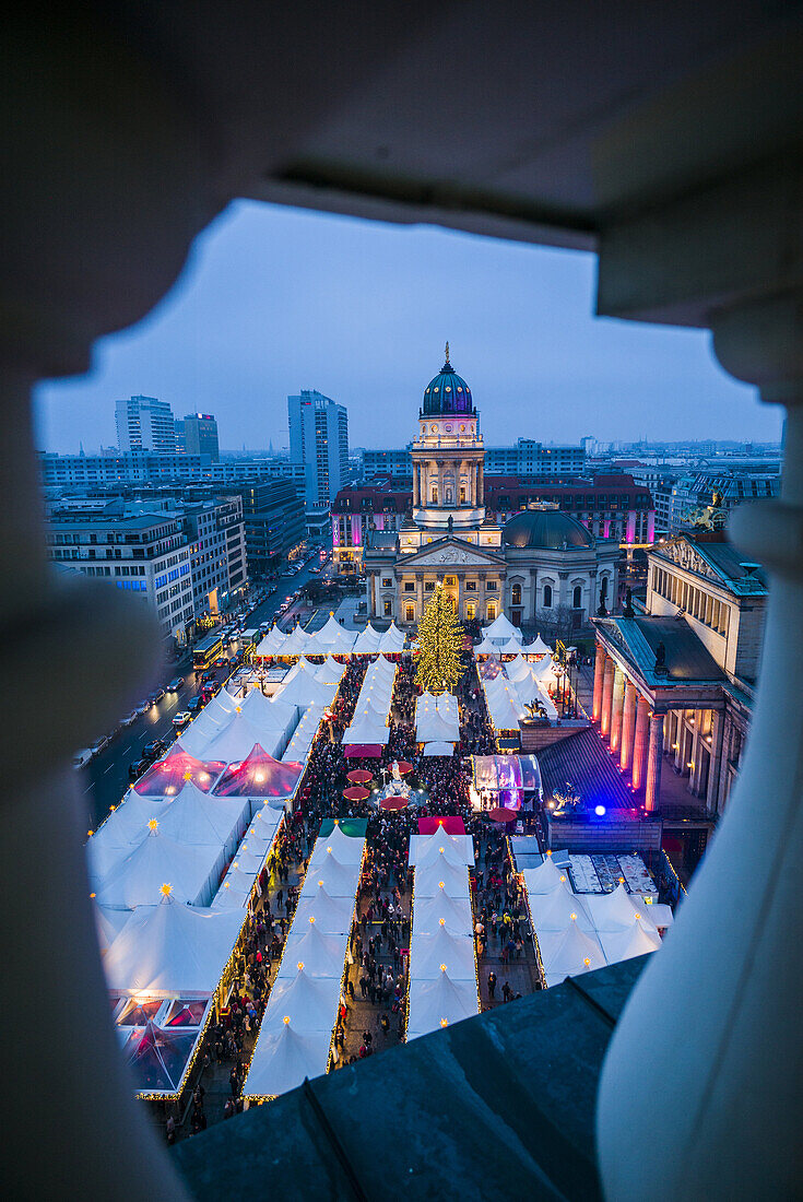 Germany, Berlin, Mitte, Gendarmenmarkt, Christmas market, elevated view with Deutscher Dom, dusk.