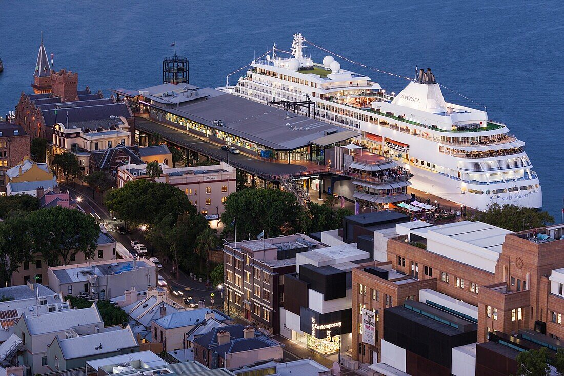 Australia, New South Wales, NSW, Sydney, The Rocks area and cruiseship, elevated view, dusk.