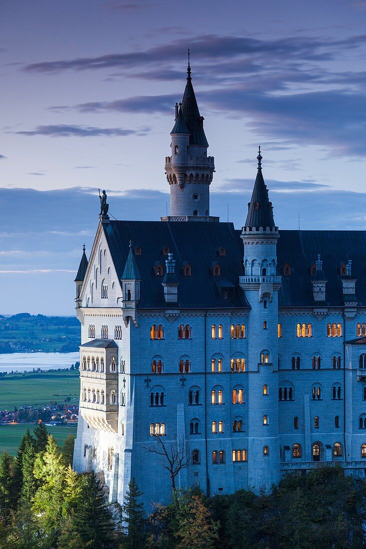 Germany, Bavaria, Hohenschwangau, Schloss Neuschwanstein castle, Marienbrucke bridge view, dusk.