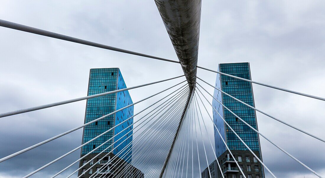 Zubizuri bridge and Isozaki Atea Towers. Bilbao, Bizkaia, Basque Country, Spain, Europe.