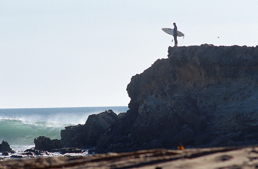 Surfer on a cliff, Mauritania.