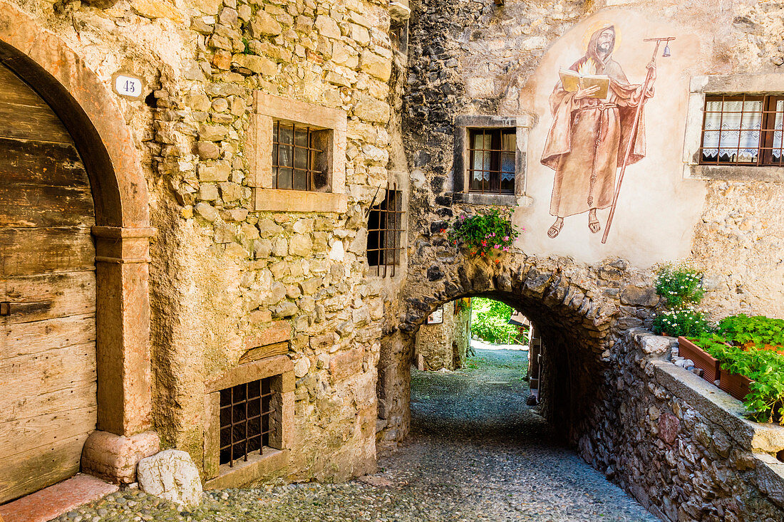 Canale, Tenno, Province of Trento, Trentino Alto Adige, Italy. Medieval village on mountain above lake.