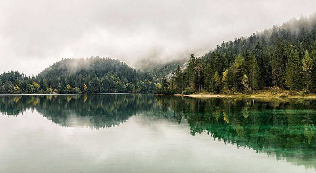 Italy, Trentino Alto Adige, Non valley, autumn reflections at Tovel Lake